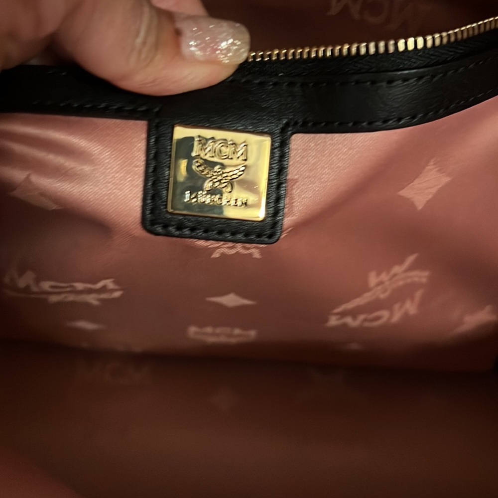 MCM large backpacks with detachable front pockets and use as crossbody bags.. - Picture 7 of 12